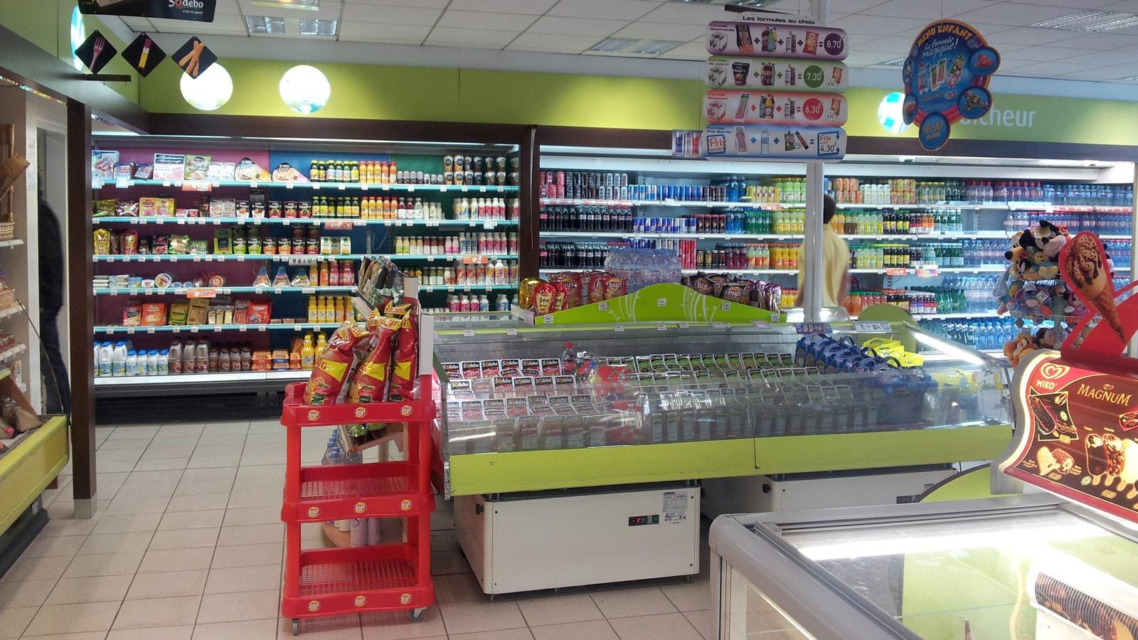 Cold and refrigerated counters inside shop of Total petrol station