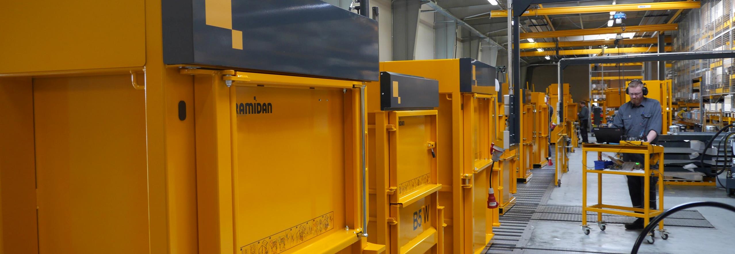 Yellow Bramidan Balers on assembly line at Bramidan factory